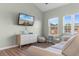 Living area with nice light, TV, dresser, and comfortable seating and views at 3935 Gladiola Ct. # 302, Myrtle Beach, SC 29588