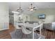 The cozy living room and dining area features a ceiling fan and beach view TV at 3935 Gladiola Ct. # 302, Myrtle Beach, SC 29588