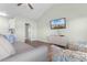 Bright living area with beach view TV, dresser, and comfortable seating at 3935 Gladiola Ct. # 302, Myrtle Beach, SC 29588