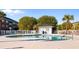 Community pool with clear blue water, white fence, palm trees, and nearby condos at 3935 Gladiola Ct. # 302, Myrtle Beach, SC 29588