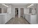 Bright bathroom featuring double vanities and marble flooring with access to and walk-in closets at 397 St. Julian Ln., Myrtle Beach, SC 29579