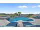 Stunning infinity pool overlooking the lake with comfortable lounge seating at 397 St. Julian Ln., Myrtle Beach, SC 29579
