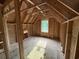 New construction attic space featuring a window and framed walls at 402 S Magnolia Ave., Andrews, SC 29510