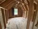 New attic space features a window and wood framing at 402 S Magnolia Ave., Andrews, SC 29510