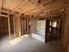 Unfinished bathroom with tub and wood stud framing and plywood walls ready for customization at 402 S Magnolia Ave., Andrews, SC 29510