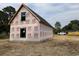 New construction home with black metal roof, ready for customization at 402 S Magnolia Ave., Andrews, SC 29510
