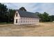 New construction home featuring a metal roof, ready for customization at 402 S Magnolia Ave., Andrews, SC 29510