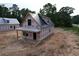 New home with simple porch and metal roof. Ready for a homeowner to customize at 402 S Magnolia Ave., Andrews, SC 29510