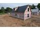 New home showcases clean lines, a metal roof, and large window openings at 402 S Magnolia Ave., Andrews, SC 29510