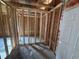 Unfinished room shows wood stud framing and plywood walls ready for customization and modification at 402 S Magnolia Ave., Andrews, SC 29510