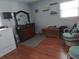 Comfortable bedroom with natural light, wood floors, and ample closet space at 4083 Sand Trap Ave., Little River, SC 29566