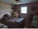 Cozy bedroom featuring a comfortable bed, wood floors, and soft lighting at 4083 Sand Trap Ave., Little River, SC 29566