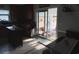 Cozy kitchen with an adjacent sunroom visible through sliding glass doors, providing a warm ambiance at 4083 Sand Trap Ave., Little River, SC 29566