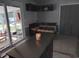 Breakfast nook off the kitchen with an outside view from the sliding glass doors and a candle centerpiece at 4083 Sand Trap Ave., Little River, SC 29566