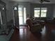Comfortable living room featuring wood floors, natural light, and stylish decor at 4083 Sand Trap Ave., Little River, SC 29566
