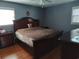Spacious main bedroom with wood floors, large windows, and ample closet space at 4083 Sand Trap Ave., Little River, SC 29566