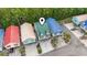 Aerial view of colorful beach homes with ample parking and lush landscaping at 4331 Grande Harbour Blvd., Little River, SC 29566