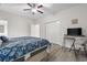 Bright bedroom boasts a closet, television, and light-colored vinyl flooring at 4331 Grande Harbour Blvd., Little River, SC 29566