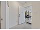 Neutral entryway featuring a secure door leading to garage space with outdoor dining at 4331 Grande Harbour Blvd., Little River, SC 29566