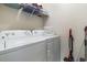 Laundry room showcasing a washer and dryer, as well as wire rack shelving at 4331 Grande Harbour Blvd., Little River, SC 29566