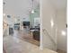 Open-concept living space with gray sectional, fan and view into bedroom with blue bedding at 4331 Grande Harbour Blvd., Little River, SC 29566