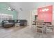 Open living room with gray sofa, ceiling fan, and dining area at 4331 Grande Harbour Blvd., Little River, SC 29566