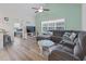 Comfortable living room featuring stylish seating and a ceiling fan at 4331 Grande Harbour Blvd., Little River, SC 29566