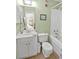 Compact bathroom featuring a vanity sink, toilet, and combined shower and bathtub at 4350 Intercoastal Dr. # 1101, Little River, SC 29566