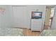 Well-decorated bedroom with two beds, a television, and a closet at 4350 Intercoastal Dr. # 1101, Little River, SC 29566