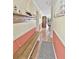 Inviting hallway featuring a cozy bench, nautical decor, and a glimpse into the dining area at 4350 Intercoastal Dr. # 1101, Little River, SC 29566