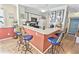 Bright kitchen with updated appliances, bar seating, and a view into the adjacent living space at 4350 Intercoastal Dr. # 1101, Little River, SC 29566