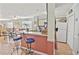 Open concept kitchen with a bar counter and seating adjacent to the dining area at 4350 Intercoastal Dr. # 1101, Little River, SC 29566