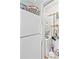 Convenient laundry closet with washer, dryer, and shelving for storage at 4350 Intercoastal Dr. # 1101, Little River, SC 29566