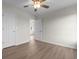 Bedroom with modern floors, ceiling fan and neutral paint and access to a bathroom at 4387 Heartwood Ln., Myrtle Beach, SC 29579