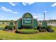Carolina Forest community entrance sign with well manicured greenery and a blue sky at 4387 Heartwood Ln., Myrtle Beach, SC 29579