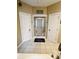 Bright bathroom with a glass-enclosed shower stall, neutral tile, and a bathtub at 4447 River Rd., Little River, SC 29566