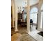 Elegant dining room with beautiful columns, a large window, and stylish lighting at 4447 River Rd., Little River, SC 29566