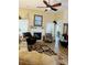 Inviting living room featuring a cozy fireplace, large windows, and comfortable seating at 4447 River Rd., Little River, SC 29566
