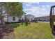 Expansive backyard with lush lawn, Adirondack seating area, ideal for outdoor activities and entertaining at 4501 N Ocean Blvd., North Myrtle Beach, SC 29582