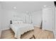 Comfortable bedroom with white walls, wood-look floors, a queen size bed, and white trim at 4501 N Ocean Blvd., North Myrtle Beach, SC 29582