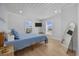 Bright bedroom featuring wood floors, a comfy blue quilted bed and a flatscreen TV at 4501 N Ocean Blvd., North Myrtle Beach, SC 29582