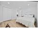 Comfortable bedroom featuring a queen-sized bed, spacious closet, and a tranquil aesthetic at 4501 N Ocean Blvd., North Myrtle Beach, SC 29582