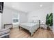 Serene bedroom featuring a bed, plants, light colored walls, and matching nightstands at 4501 N Ocean Blvd., North Myrtle Beach, SC 29582