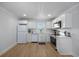 Bright kitchen featuring wood floors, stainless steel appliances and white cabinets at 4501 N Ocean Blvd., North Myrtle Beach, SC 29582