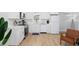 Bright kitchen featuring wood floors, stainless steel appliances and white cabinets with gold hardware at 4501 N Ocean Blvd., North Myrtle Beach, SC 29582