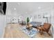 Spacious living room flowing into a bright kitchen, featuring modern decor and comfortable seating at 4501 N Ocean Blvd., North Myrtle Beach, SC 29582