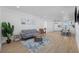 Open-concept living area with modern decor, wood-look floors, and lots of natural light at 4501 N Ocean Blvd., North Myrtle Beach, SC 29582