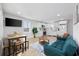 A living room, dining room and kitchen combo featuring wood floors and modern furniture at 4501 N Ocean Blvd., North Myrtle Beach, SC 29582