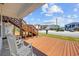 Charming porch with wooden deck, white rocking chairs, and views of the neighborhood street at 4501 N Ocean Blvd., North Myrtle Beach, SC 29582
