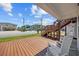 Inviting porch with wood deck, white rocking chairs, and view of neighborhood at 4501 N Ocean Blvd., North Myrtle Beach, SC 29582
